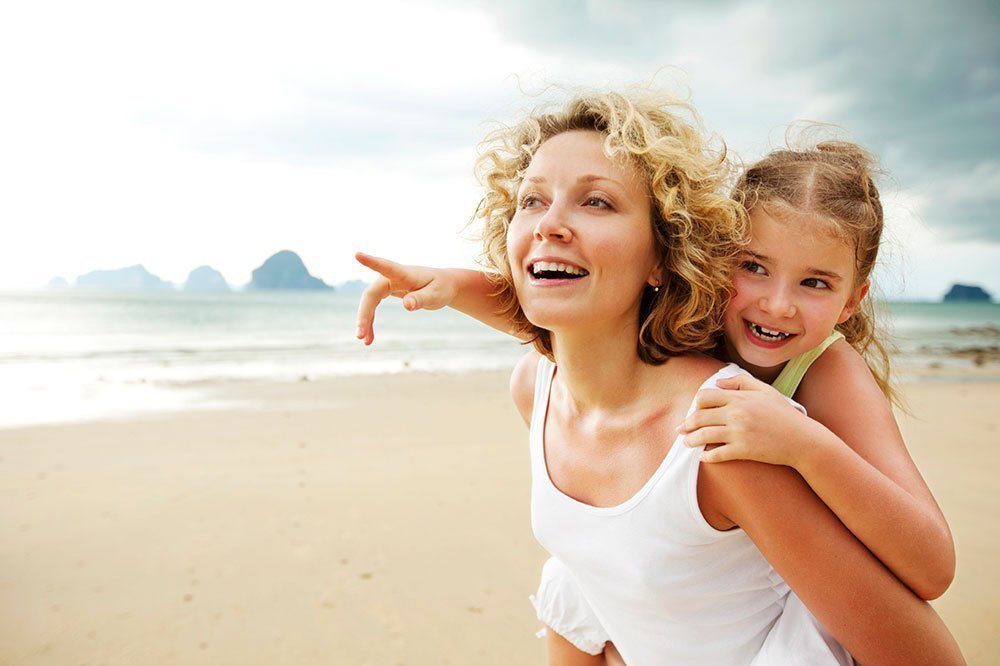 STE mother daughter piggyback beach